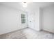 Simple bedroom with grey carpet and a window with natural light at 1013 Cathey Rd, Charlotte, NC 28214