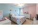 Charming bedroom with floral bedding and natural light at 112 Marquette Dr, Mount Holly, NC 28120