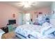 Another bedroom with floral bedding and a desk area at 112 Marquette Dr, Mount Holly, NC 28120