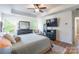 Bright bedroom featuring a ceiling fan and hardwood floors at 112 Marquette Dr, Mount Holly, NC 28120