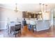 Bright dining area with hardwood floors and kitchen access at 112 Marquette Dr, Mount Holly, NC 28120