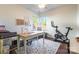 Home office with built-in desk and exercise bike at 112 Marquette Dr, Mount Holly, NC 28120