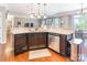 Kitchen island with granite countertop and stainless steel dishwasher at 112 Marquette Dr, Mount Holly, NC 28120