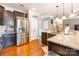 Kitchen features stainless steel refrigerator and granite countertops at 112 Marquette Dr, Mount Holly, NC 28120