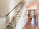 Elegant staircase with wooden railing leading to the upper level at 112 Marquette Dr, Mount Holly, NC 28120