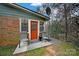 Brick patio with two chairs, located in a wooded backyard setting at 114 Ashbrook Dr, Fort Mill, SC 29715