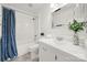 Clean bathroom, featuring a shower/tub combo, white vanity, and blue shower curtain at 114 Ashbrook Dr, Fort Mill, SC 29715