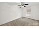 Spacious bedroom with window, ceiling fan and neutral carpeting at 114 Ashbrook Dr, Fort Mill, SC 29715