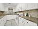 White kitchen with ample counter space and tile backsplash at 114 Ashbrook Dr, Fort Mill, SC 29715