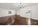 Living room features hardwood floors and a modern chandelier at 114 Ashbrook Dr, Fort Mill, SC 29715