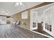 Sunroom with French doors opening to the interior and wood-look flooring at 114 Ashbrook Dr, Fort Mill, SC 29715