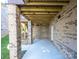 Unfinished basement patio with brick walls and concrete flooring at 1422 Spring Ridge Ln, Denver, NC 28037