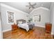 Large bedroom with hardwood floors and ample natural light at 1422 Spring Ridge Ln, Denver, NC 28037