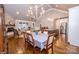 Bright dining area with hardwood floors and a view of the kitchen and living room at 1422 Spring Ridge Ln, Denver, NC 28037