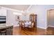 Formal dining area with hardwood floors and a charming built-in hutch at 1422 Spring Ridge Ln, Denver, NC 28037