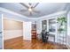 Bright home office with built-in shelving and hardwood floors at 1422 Spring Ridge Ln, Denver, NC 28037