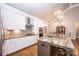 Modern kitchen with white cabinets, granite countertops, and stainless steel appliances at 1422 Spring Ridge Ln, Denver, NC 28037