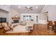 Spacious living room featuring hardwood floors, a stone fireplace, and ample natural light at 1422 Spring Ridge Ln, Denver, NC 28037