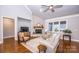 Living area with hardwood floors, fireplace, and comfortable seating at 1422 Spring Ridge Ln, Denver, NC 28037