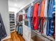 Large walk-in closet with custom built-ins and shoe storage at 1422 Spring Ridge Ln, Denver, NC 28037