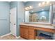 Bathroom with granite countertop, large mirror, and tiled shower at 14839 Rocky Top Dr, Huntersville, NC 28078