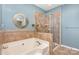 Bathroom with a garden tub and separate glass shower at 14839 Rocky Top Dr, Huntersville, NC 28078