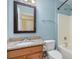 Clean bathroom with light blue walls, granite countertop, and a tub shower combo at 14839 Rocky Top Dr, Huntersville, NC 28078