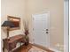 Traditional entryway with hardwood floors, a console table, and artwork at 14839 Rocky Top Dr, Huntersville, NC 28078