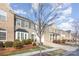 Row of townhouses featuring neutral color palettes and attached garages at 14839 Rocky Top Dr, Huntersville, NC 28078