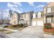 Two-story townhome with brick and siding, two-car garage, and manicured landscaping at 14839 Rocky Top Dr, Huntersville, NC 28078