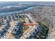 Aerial view of houses and neighborhood with river in background at 1968 Sapphire Meadow Dr, Fort Mill, SC 29715