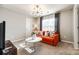 Bedroom with orange couch and a round coffee table at 1968 Sapphire Meadow Dr, Fort Mill, SC 29715