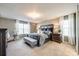 Main bedroom with large bed and sitting area at 1968 Sapphire Meadow Dr, Fort Mill, SC 29715