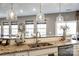 Kitchen island with granite countertops and double sink at 1968 Sapphire Meadow Dr, Fort Mill, SC 29715