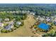 Aerial view of houses, lake, tennis courts, and walking trails at 2229 Iron Works Dr, Clover, SC 29710