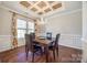 Elegant dining room with hardwood floors, chandelier, and wainscoting at 2229 Iron Works Dr, Clover, SC 29710