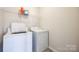 Laundry room with washer, dryer, and shelving at 2229 Iron Works Dr, Clover, SC 29710