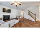 Bright living room with hardwood floors, fireplace and staircase view at 2229 Iron Works Dr, Clover, SC 29710