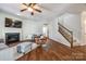 Living area with hardwood floors, fireplace, and access to upstairs at 2229 Iron Works Dr, Clover, SC 29710