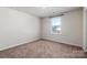 Simple bedroom with neutral walls and carpeted floors at 2547 Bullfrog Ln, Lancaster, SC 29720