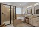 Elegant bathroom with double vanity, soaking tub, and glass shower at 2740 Smith Field Dr, Monroe, NC 28110