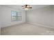 Bedroom with white walls, carpet, and accent wall at 2740 Smith Field Dr, Monroe, NC 28110