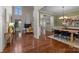 Open concept dining room with hardwood floors and view of living room at 2740 Smith Field Dr, Monroe, NC 28110