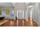 Bright and spacious entryway with hardwood floors and a view to the dining room at 2740 Smith Field Dr, Monroe, NC 28110