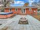 Backyard features a paved patio with a fire pit and hot tub at 2823 Edsel Pl, Charlotte, NC 28205