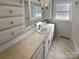 Bright bathroom with a large vanity, ample storage, and a window allowing natural light in at 2823 Edsel Pl, Charlotte, NC 28205