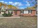 Charming brick home with landscaped yard and inviting front entrance at 2823 Edsel Pl, Charlotte, NC 28205