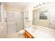 Bright bathroom with walk-in shower, vanity, and built-in cabinet at 3309 E Broad St, Statesville, NC 28625