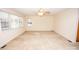 Neutral-toned bedroom with carpet flooring, large windows, and a ceiling fan at 3309 E Broad St, Statesville, NC 28625