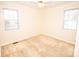 A bright, neutral bedroom with carpet flooring and natural lighting at 3309 E Broad St, Statesville, NC 28625